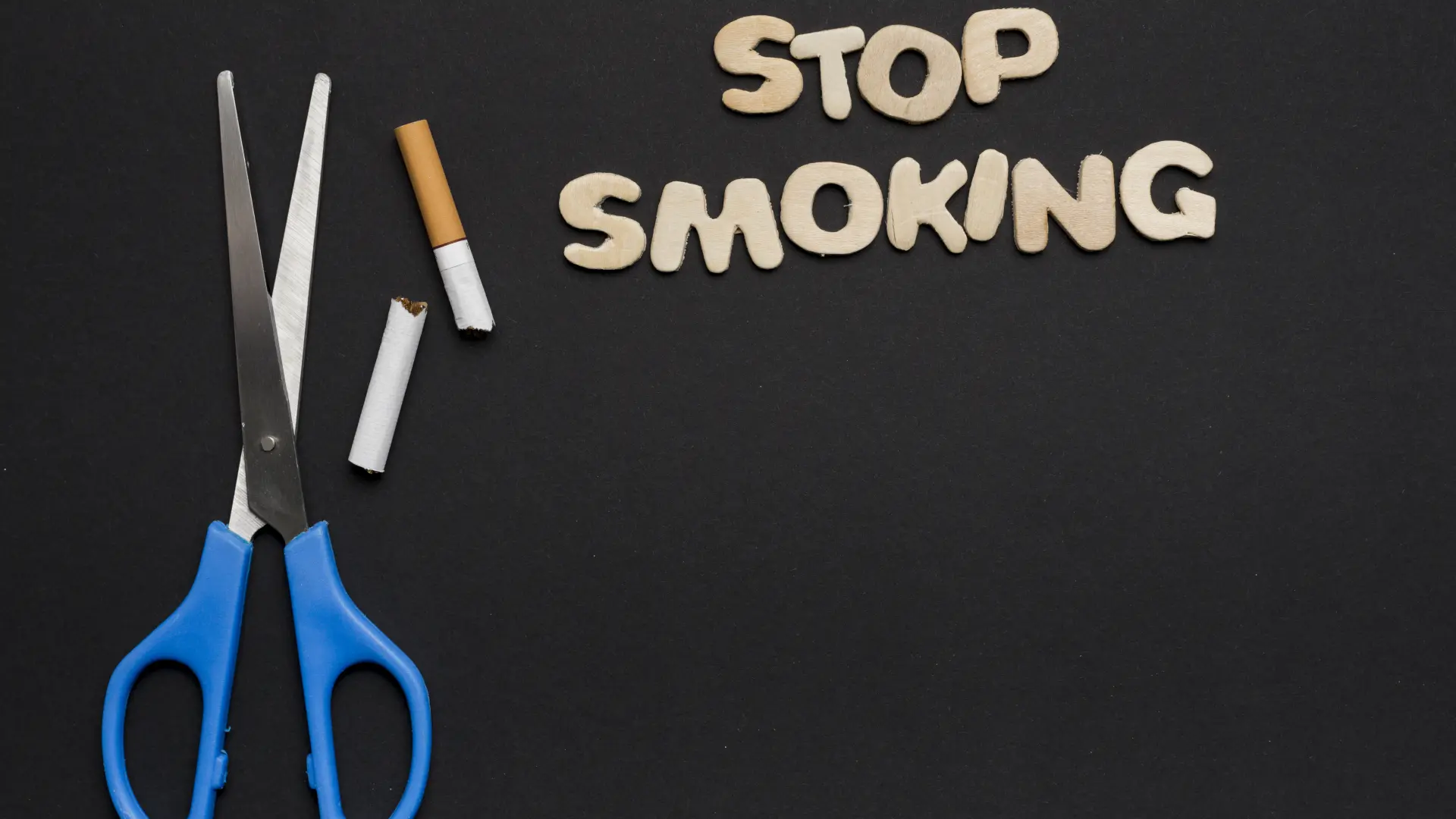stop-smoking-text-with-scissor-broken-cigarette-black-backdrop-66290b99bfac1.webp